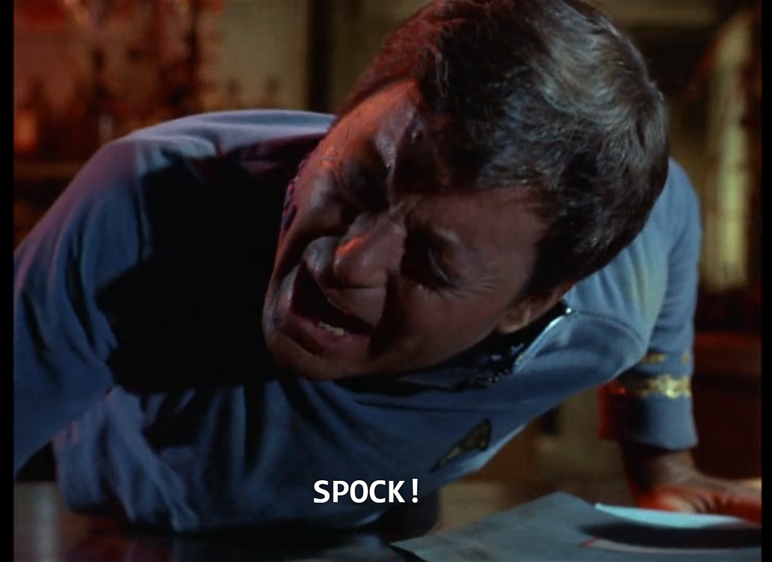 McCoy slumped against a table in pain, calling out, "Spock!" 